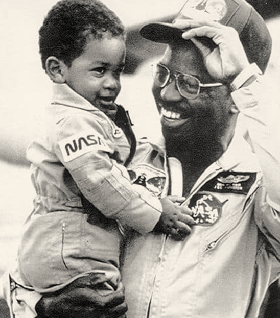 Ronald McNair holds his son